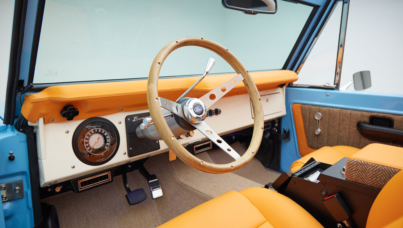 1973 Classic Ford Bronco in frozen blue with rolls royce orange leather and alpaca interior steering wheel
