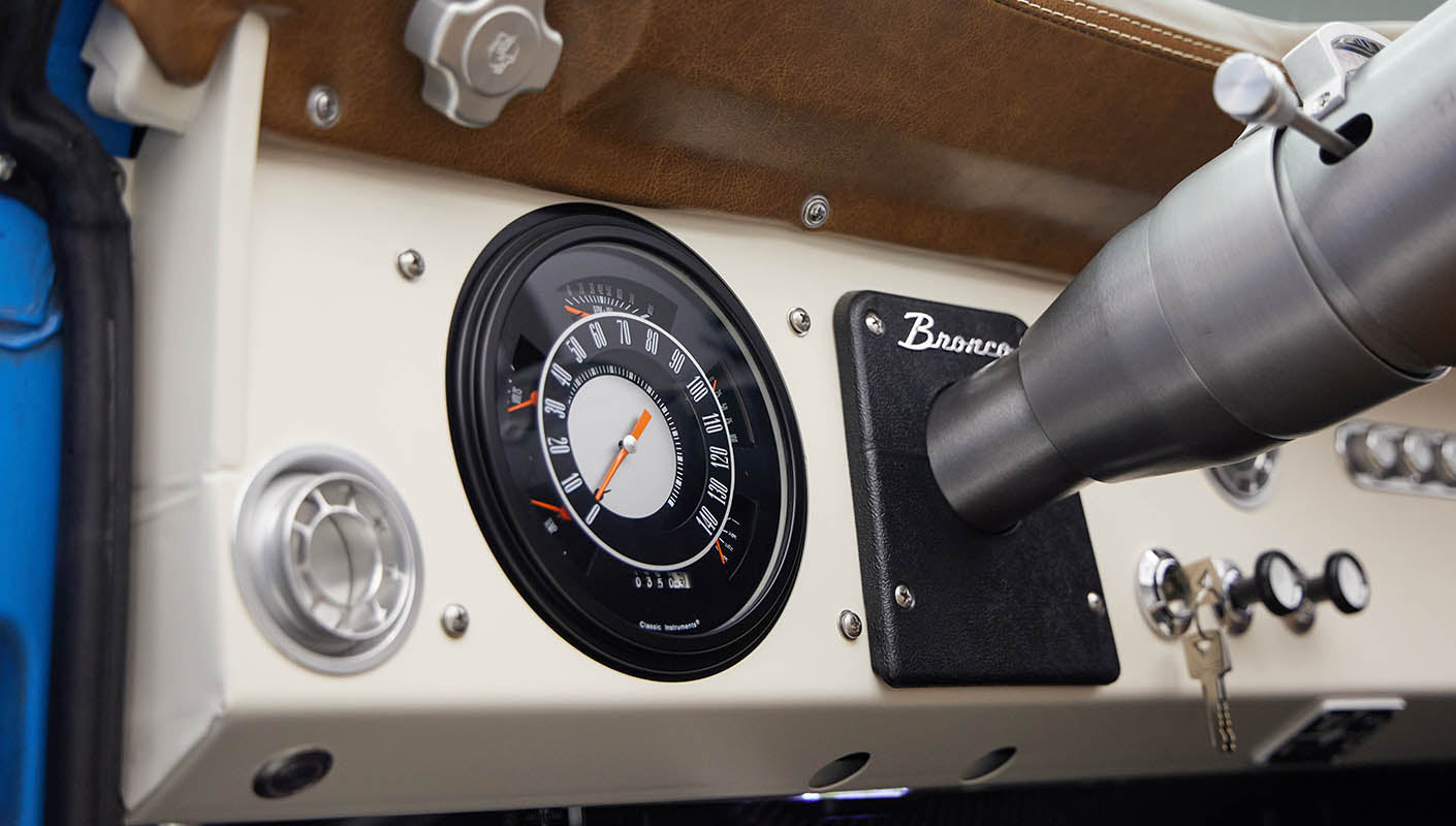 1976 classic ford bronco in blue patina paint with whiskey leather interior gauges