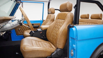 1976 classic ford bronco in blue patina paint with whiskey leather interior driver seat