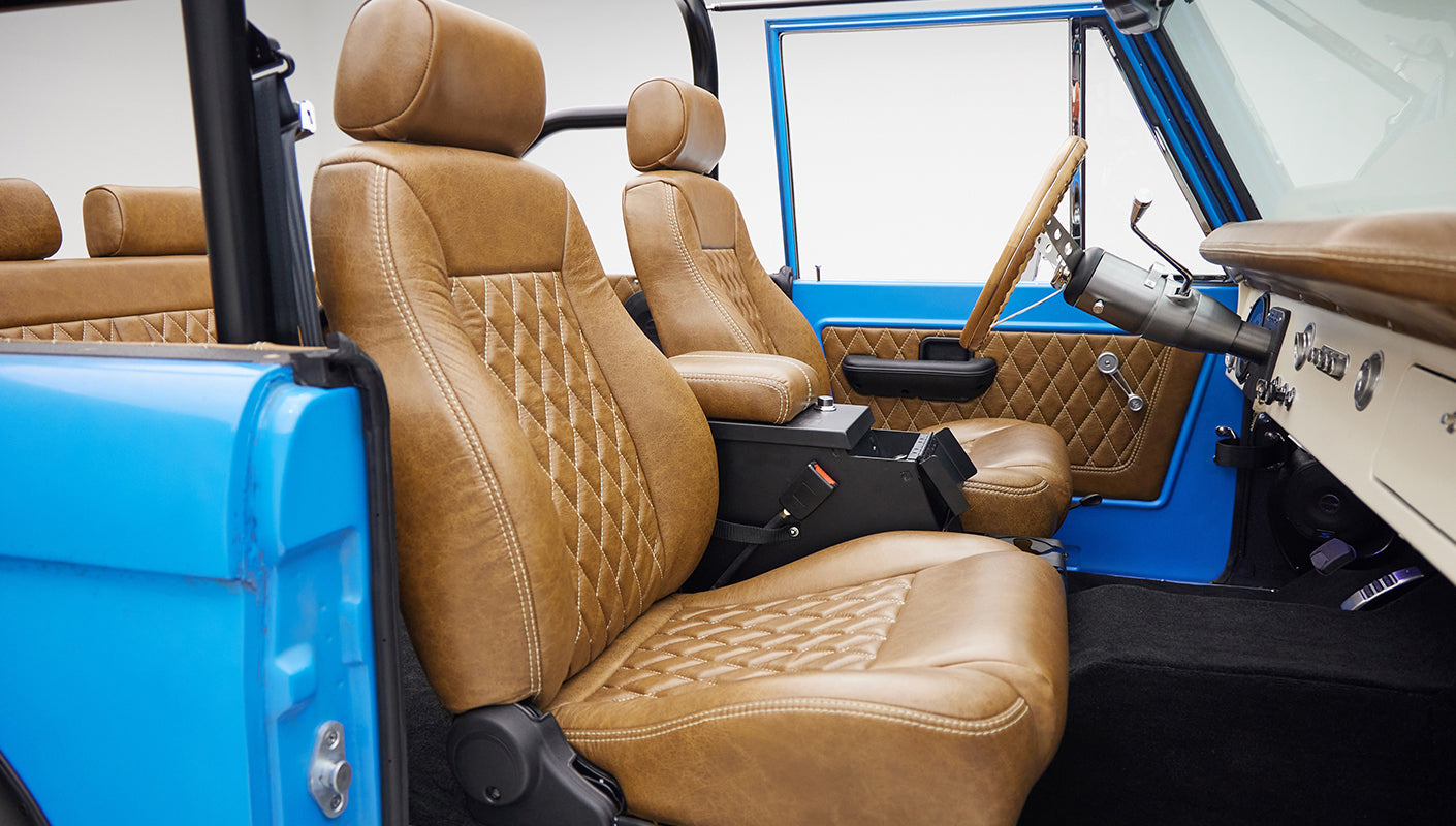 1976 classic ford bronco in blue patina paint with whiskey leather interior passenger seat