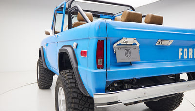 1976 classic ford bronco in blue patina paint with whiskey leather interior rear angle exterior