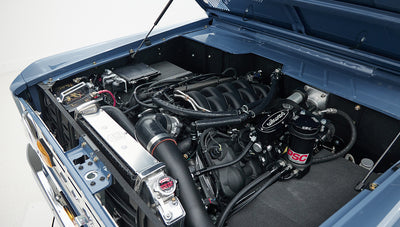 Classic Ford Bronco engine compartment showing detailed components and clean layout