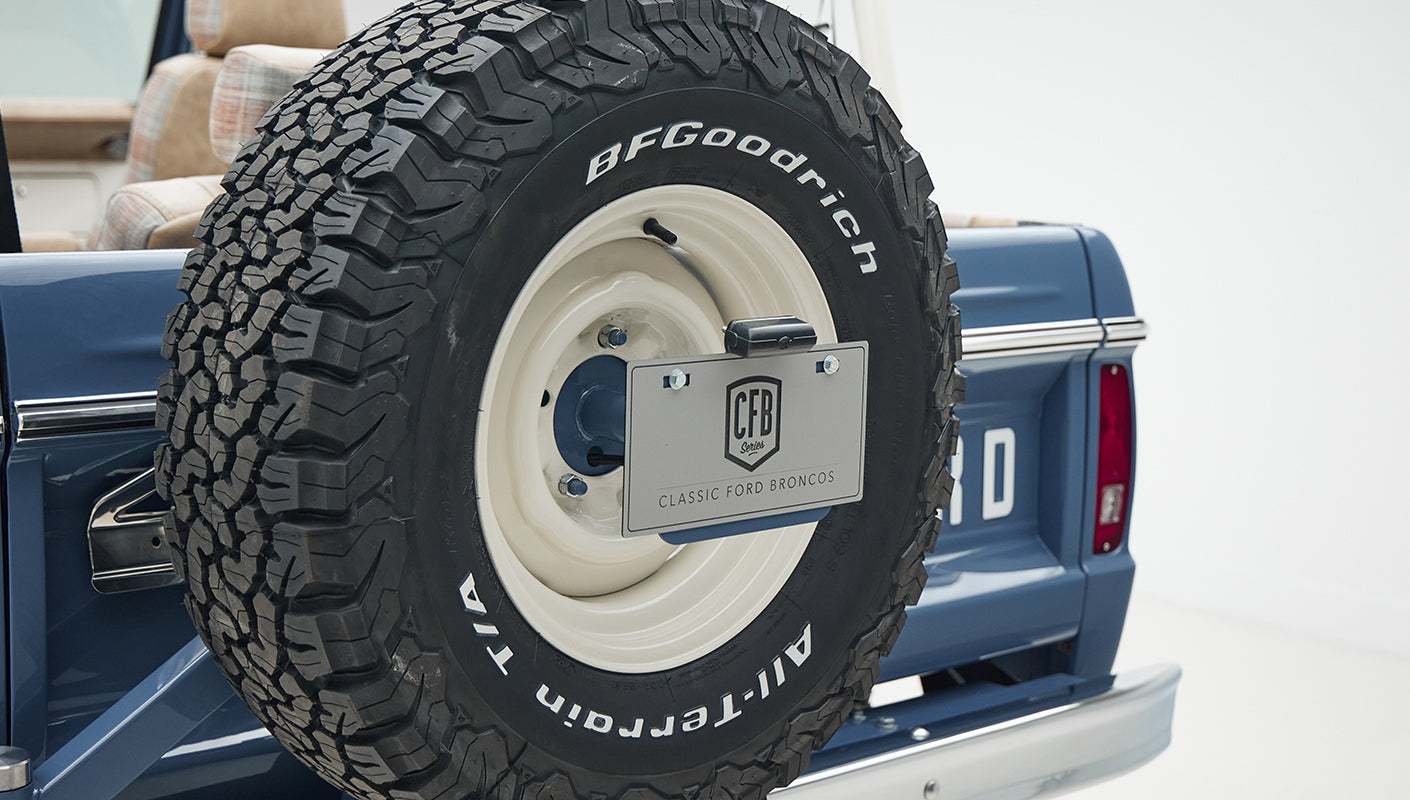 Close-up of BFGoodrich tire and Classic Ford Broncos branded rear license plate