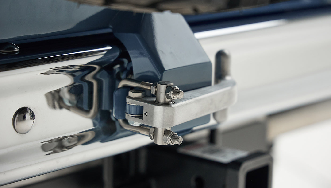 Close-up of rear bumper hitch receiver with small camera mounted on Classic Ford Bronco