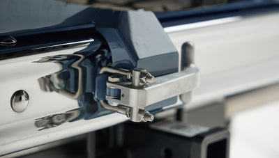 Close-up of rear bumper hitch receiver with small camera mounted on Classic Ford Bronco