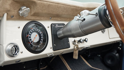 Close-up of Classic Ford Bronco speedometer and dashboard key with leather keychain