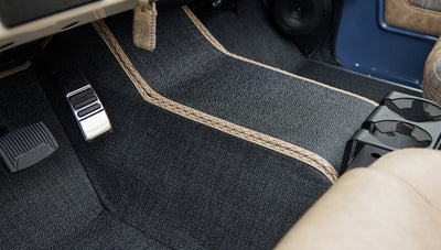 Close-up of Classic Ford Bronco front passenger floor area carpet and pedals