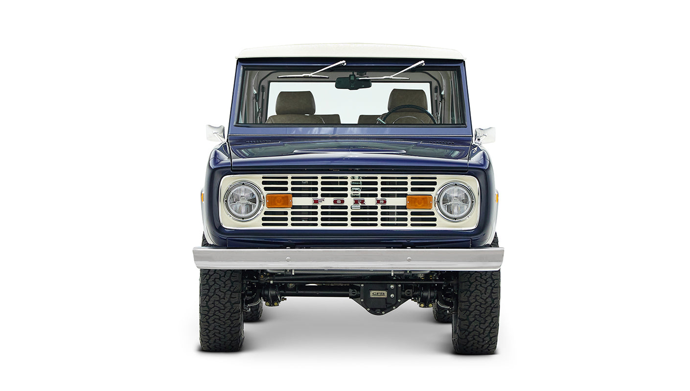 Front view of classic Ford Bronco in sapphire blue with white roof