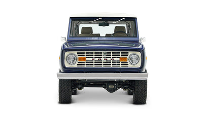 Front view of classic Ford Bronco in sapphire blue with white roof