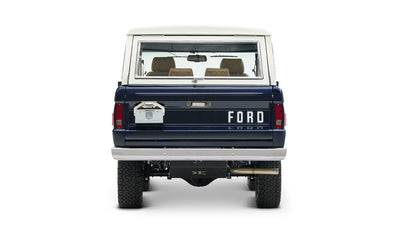 Rear view of classic Ford Bronco in sapphire blue with white hardtop