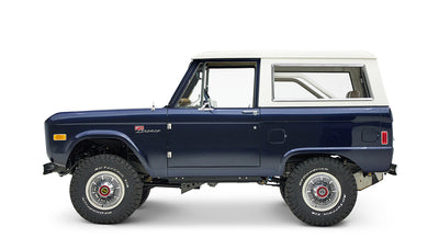 Classic Ford Bronco in sapphire blue with white hardtop, left side profile