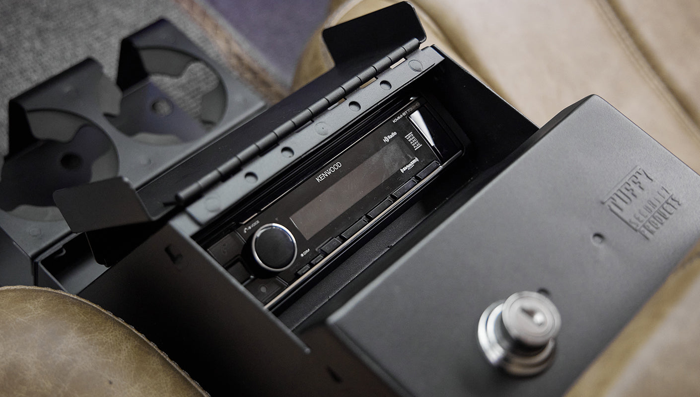Kenwood stereo unit inside center console storage compartment in Classic Ford Bronco