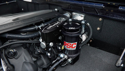 Close-up of Wilwood and PSC branded components within Classic Ford Bronco engine bay