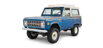 Classic Ford Bronco front driver side angled view with rusted accents and lifted suspension