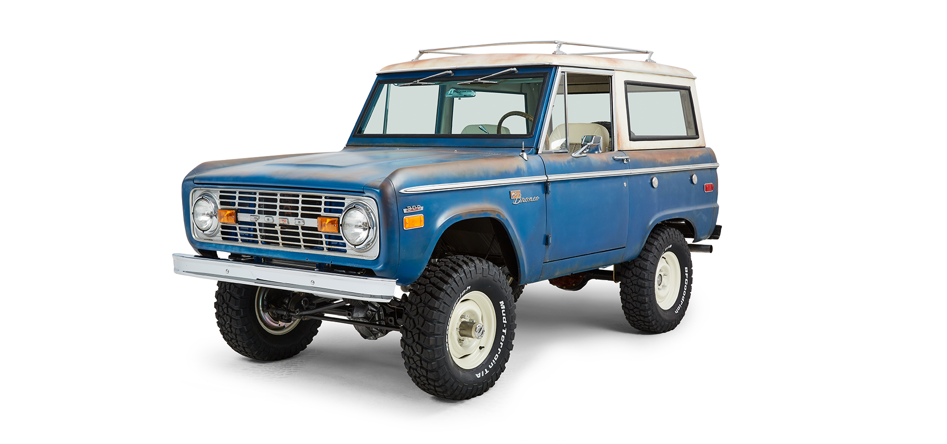 Classic Ford Bronco front driver side angled view showing body, grille, and wheels