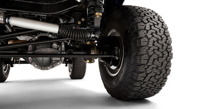 Close-up of Classic Ford Bronco front driver side suspension and tire
