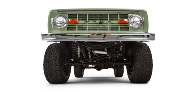 Underneath front suspension and steering components of a Classic Ford Bronco