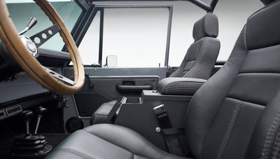 Front seats and center console interior view of Classic Ford Bronco with houndstooth accents