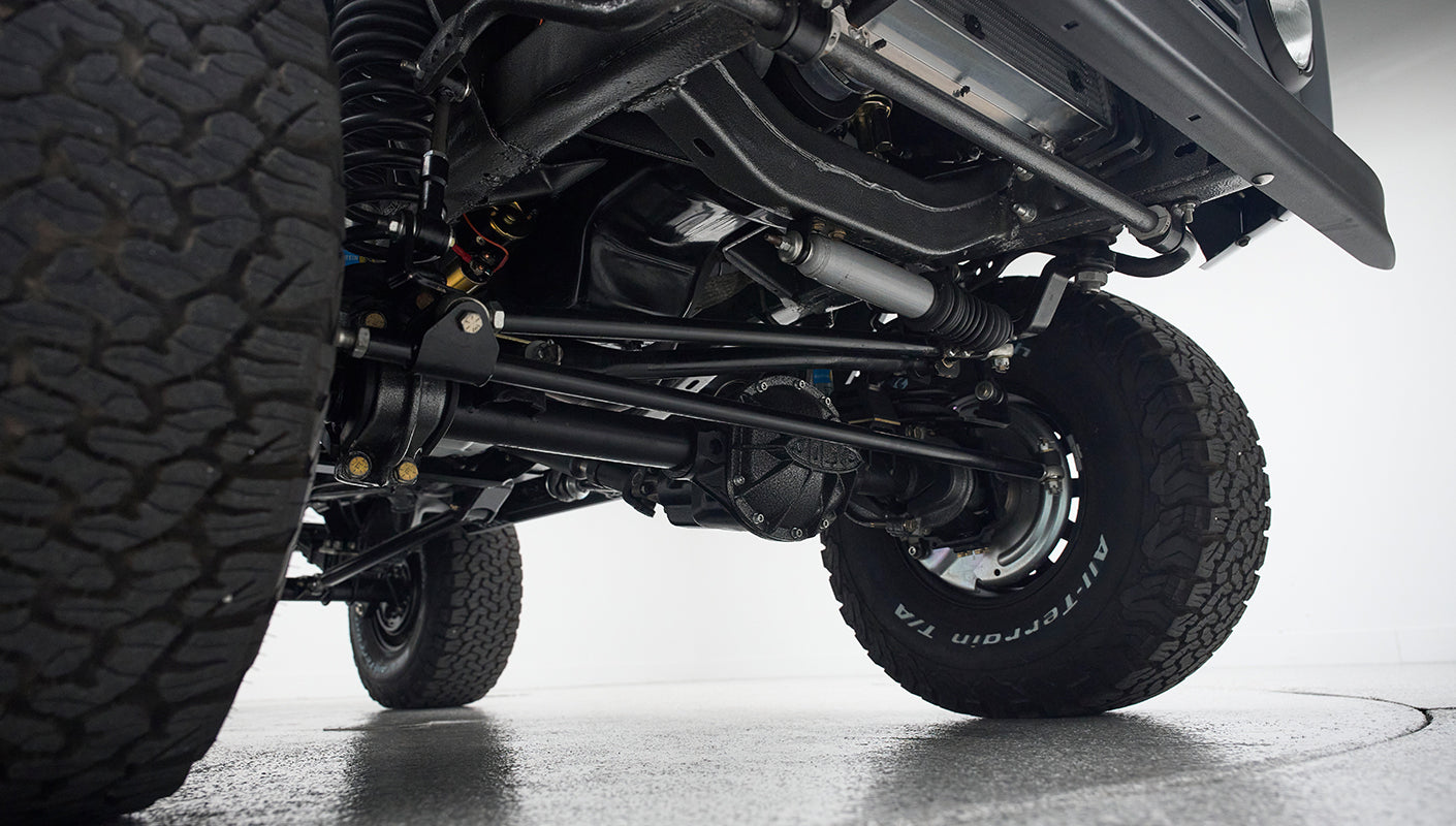 Undercarriage view of Classic Ford Bronco suspension and front tires