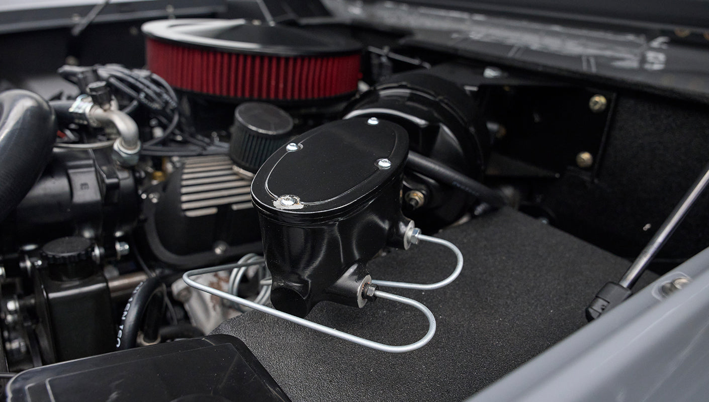 Detail of brake master cylinder and cap in Classic Ford Bronco engine bay