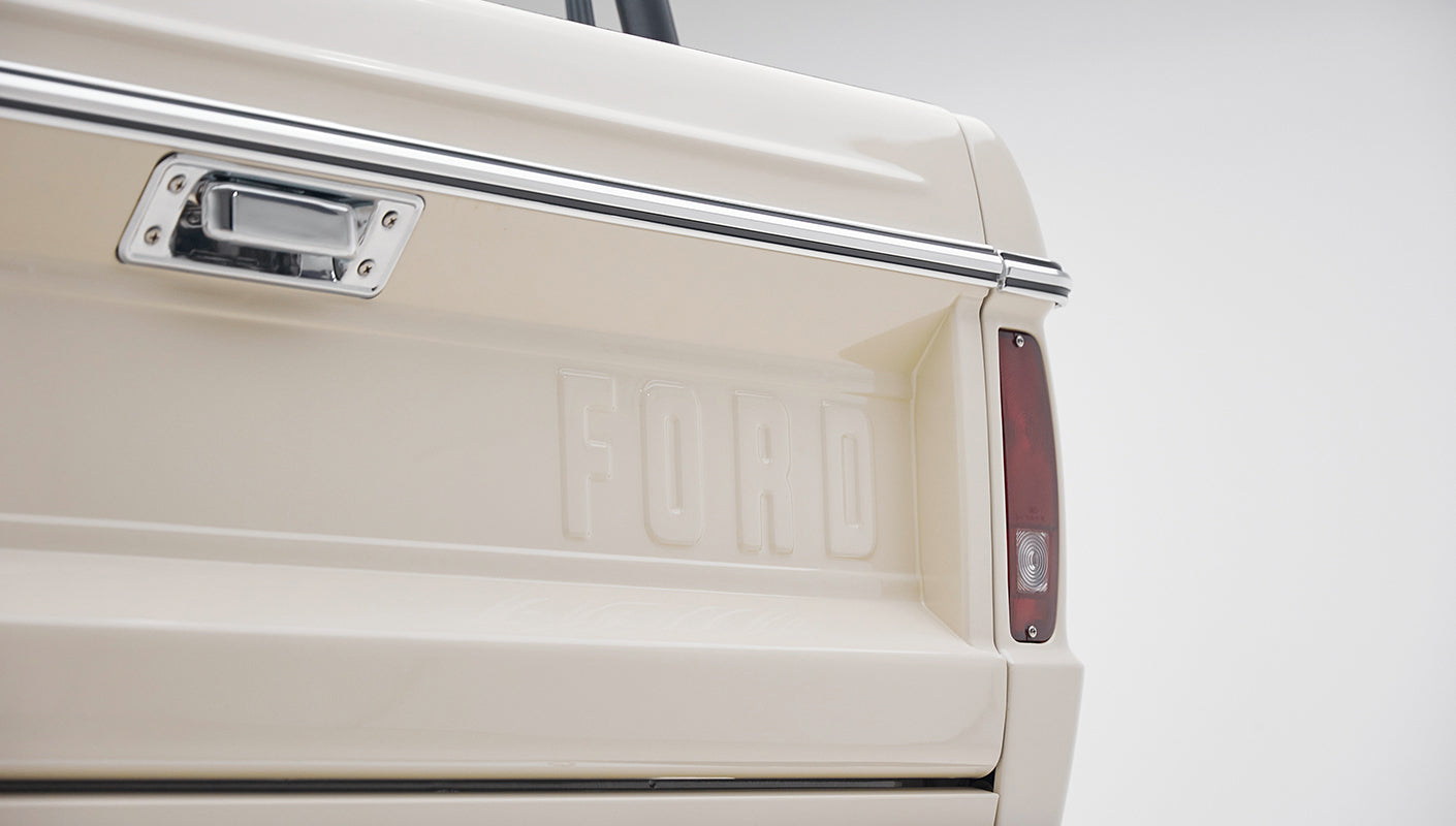 Rear of Classic Ford Bronco tailgate with embossed FORD lettering and red taillight