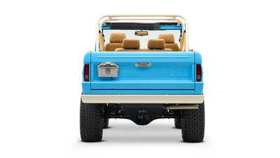 Rear view of Classic Ford Bronco in heritage blue with beige bumper and taillights visible