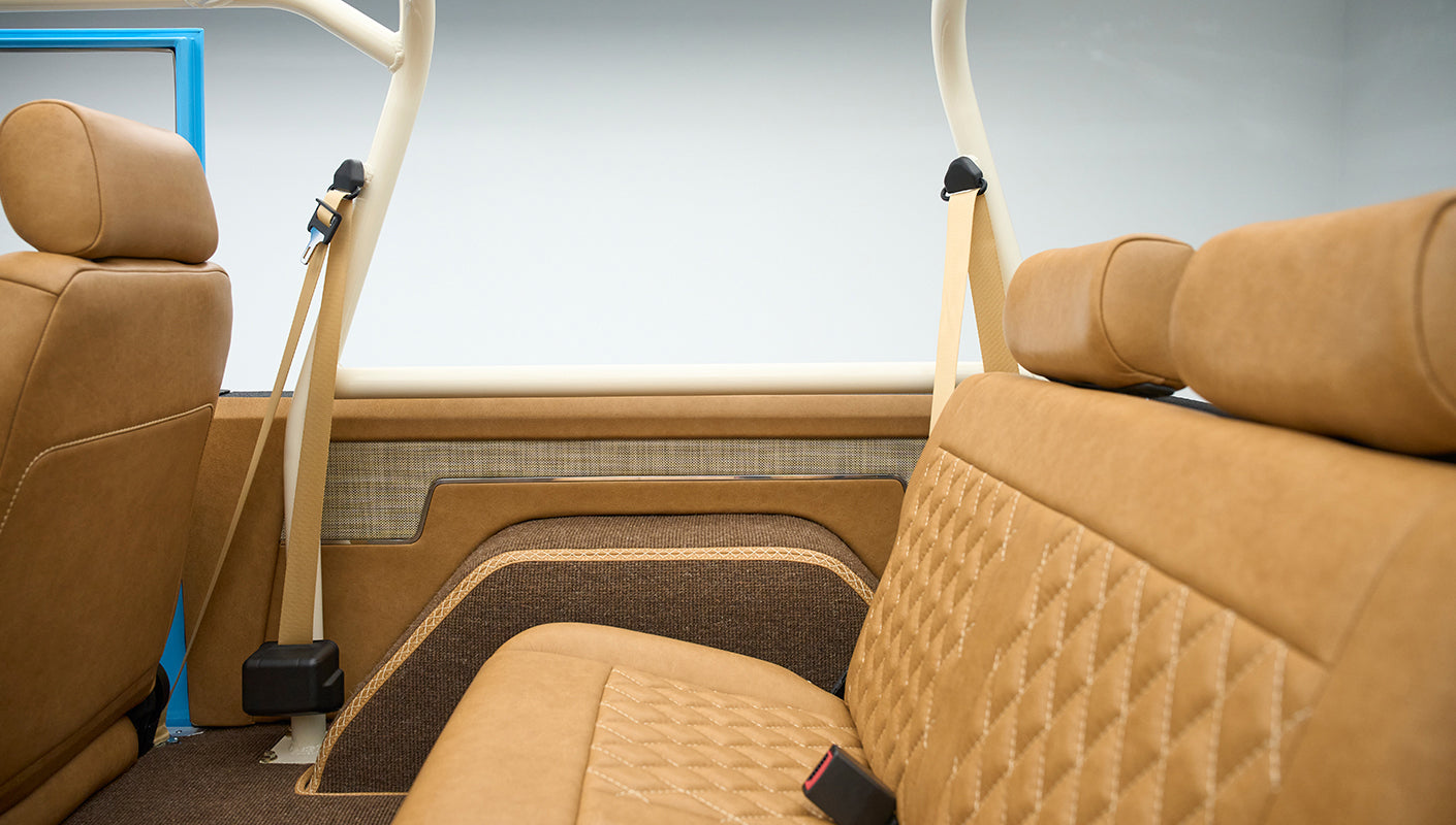 Side view of rear bench seat and interior door panel of classic Ford Bronco