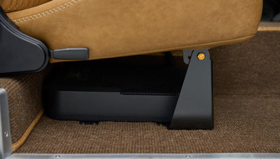 Under-seat speaker and brown carpet inside Classic Ford Bronco