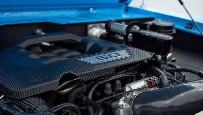 Close-up of 5.0 engine intake manifold with carbon fiber detailing inside Classic Ford Bronco