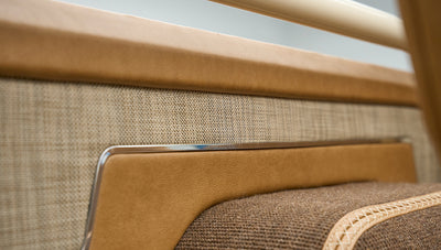 Detailed close-up of tan and fabric interior panels inside Classic Ford Bronco