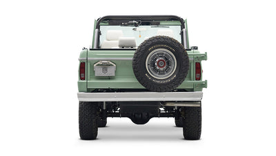 Rear view of a mint green Classic Ford Bronco with spare tire mounted on tailgate