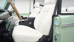 White seats with pineapple pattern inside the mint green Classic Ford Bronco