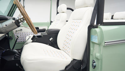 White seats with pineapple pattern inside the mint green Classic Ford Bronco