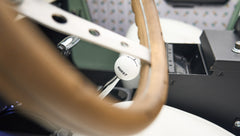 Classic Ford Bronco with wooden steering wheel and white Hurst gear shift knob
