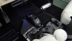 Classic Ford Bronco interior center console with gear shift levers and cup holders