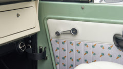 Classic Ford Bronco interior door panel with white upholstery and ice cream cone pattern