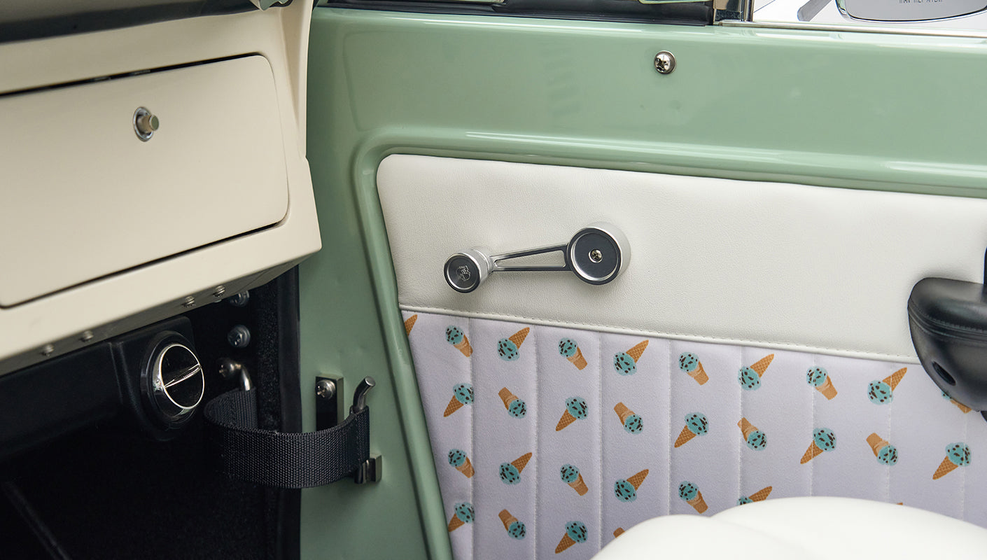 Classic Ford Bronco interior door panel with white upholstery and ice cream cone pattern