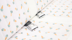 Close up of seat belt buckles on Classic Ford Bronco rear seat with ice cream cone patterned upholstery