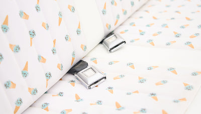 Close up of seat belt buckles on Classic Ford Bronco rear seat with ice cream cone patterned upholstery