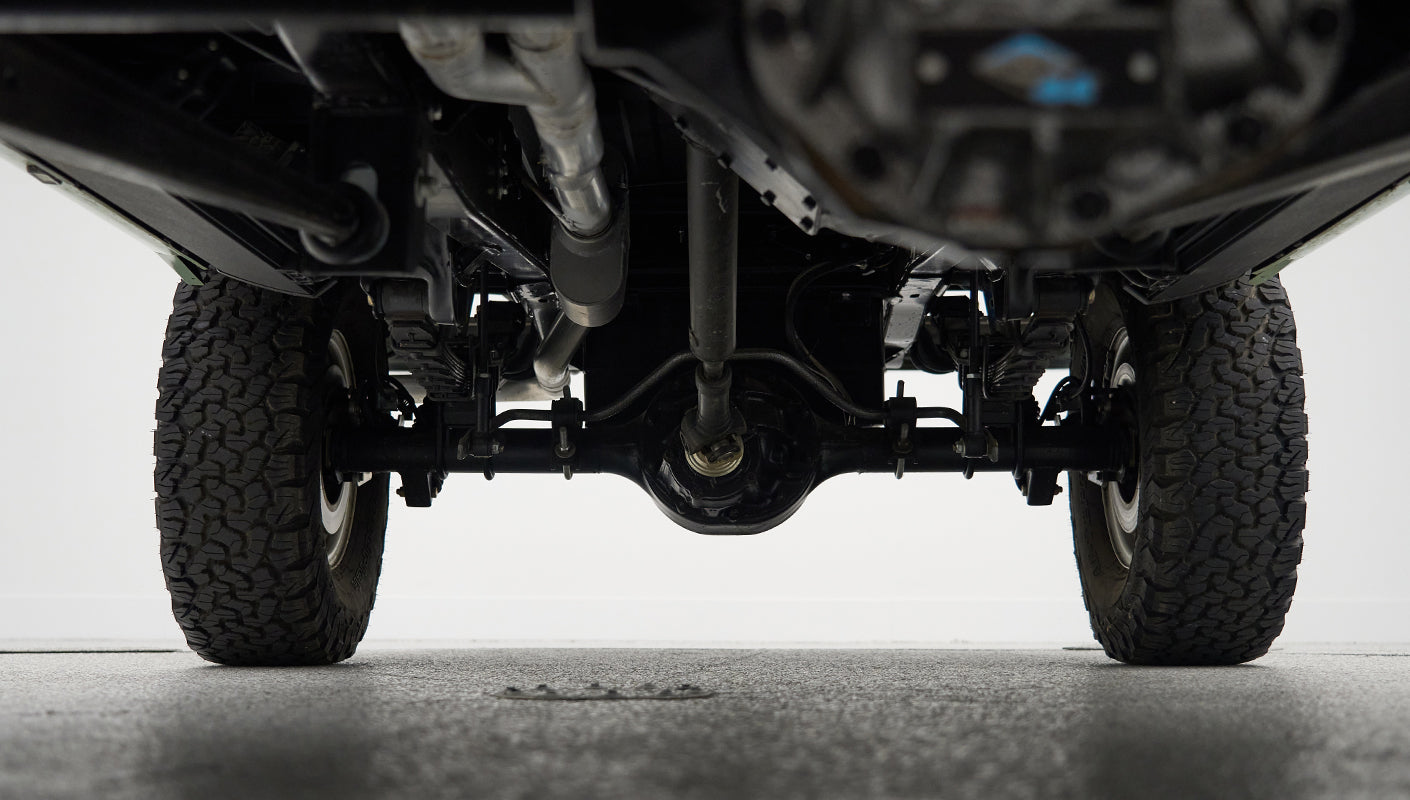 Undercarriage drivetrain of a Classic Ford Bronco, showing differential and axle