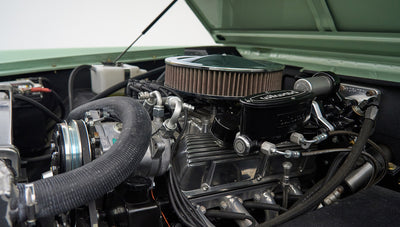 Engine bay with air intake, hoses, and several metallic engine parts
