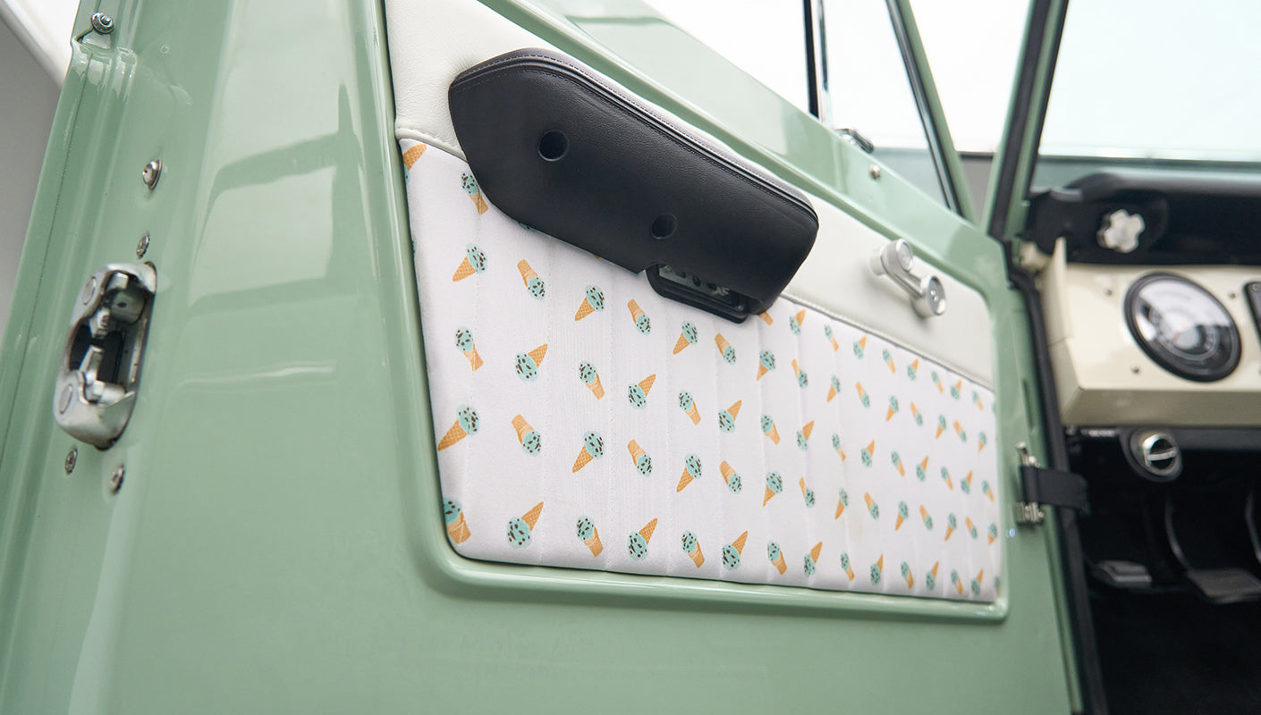 Close-up of inner driver door panel featuring fabric with ice cream cone pattern