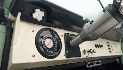 Classic Ford Bronco dashboard with speedometer and Bronco badge