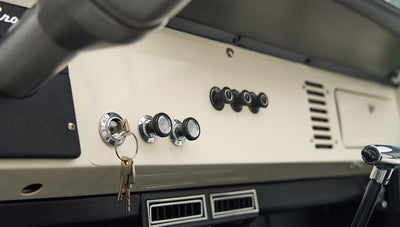 Close-up of ignition and control knobs on Classic Ford Bronco dashboard