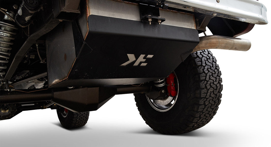 Underside view of Classic Ford Bronco showing black tank and tires with red braking components