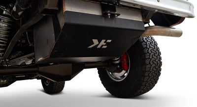 Underside view of Classic Ford Bronco showing black tank and tires with red braking components