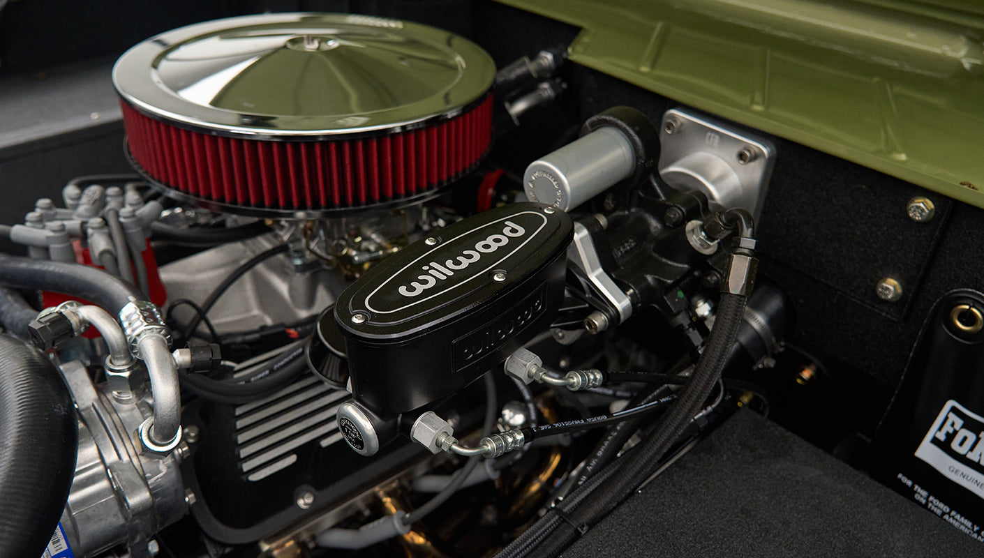 Closeup of Wilwood brake components and hoses inside Classic Ford Bronco engine bay