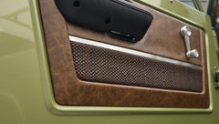 Closeup of brown textured and leather door panel on Classic Ford Bronco