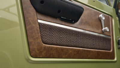 Closeup of brown textured and leather door panel on Classic Ford Bronco