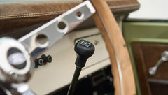 Close-up of manual gear shift knob and part of steering wheel in Classic Ford Bronco
